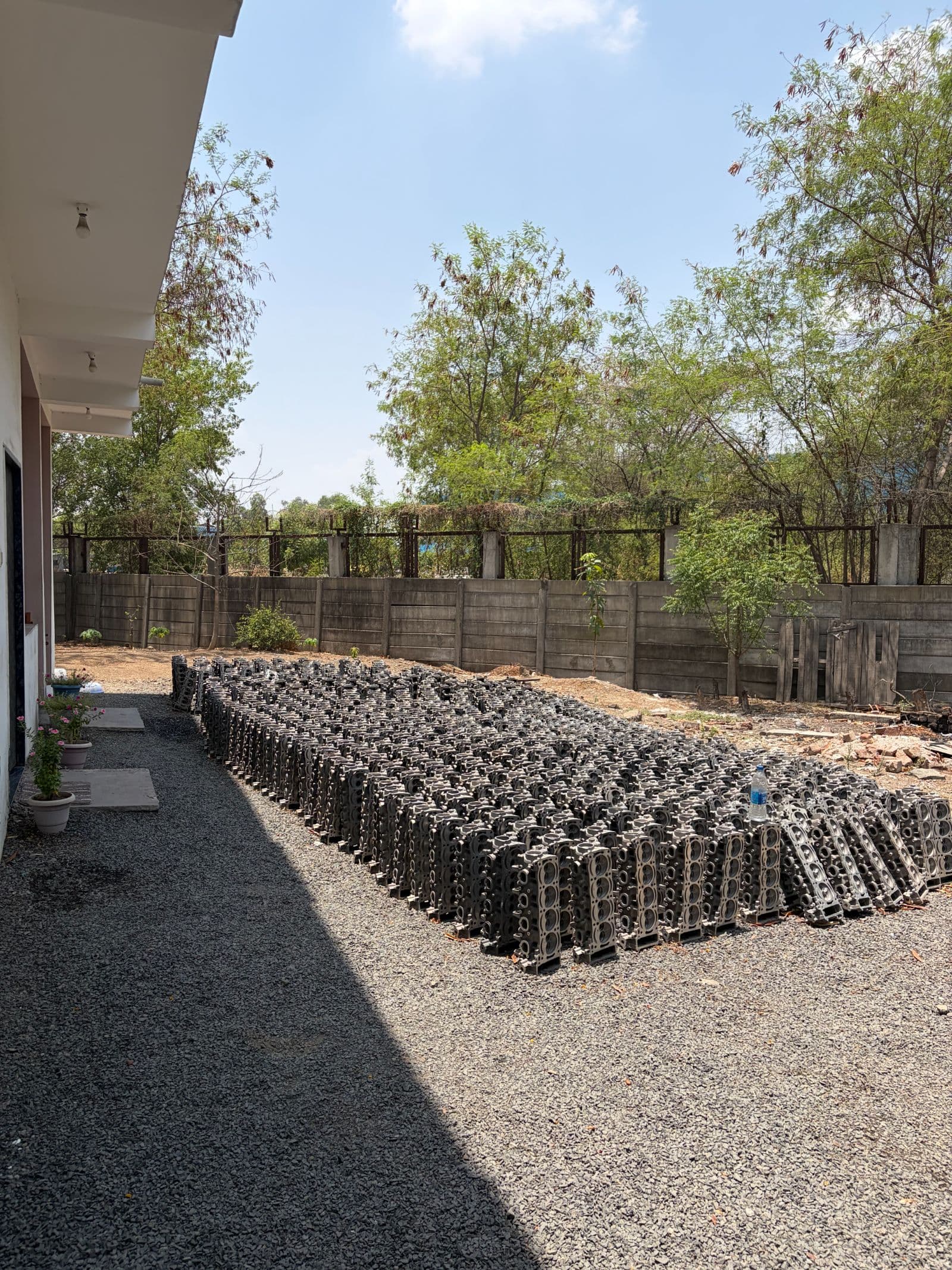 Hundreds of machined engine heads stacked and ready for dispatch